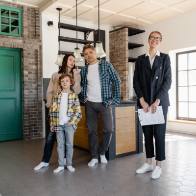 Agent and Family Looking at a Home
